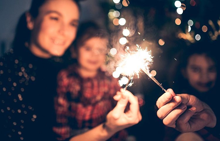 Group of people celebrating with sparklers