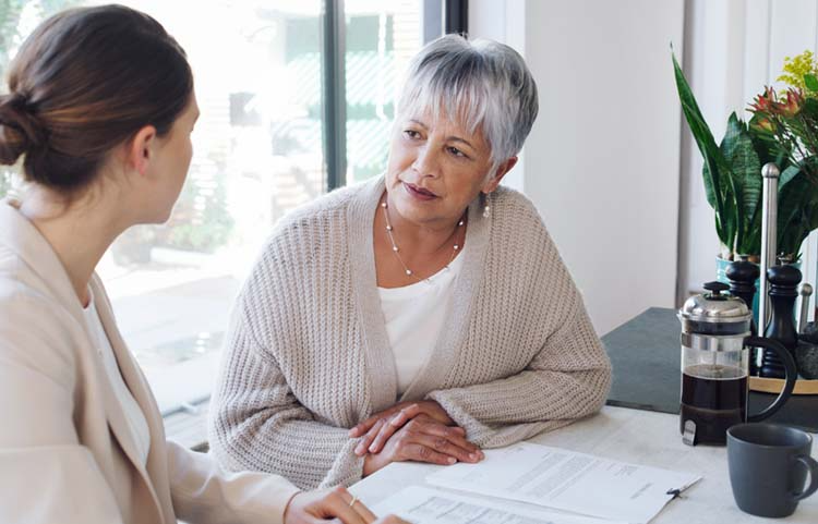 Advisor helping lady with financial plan
